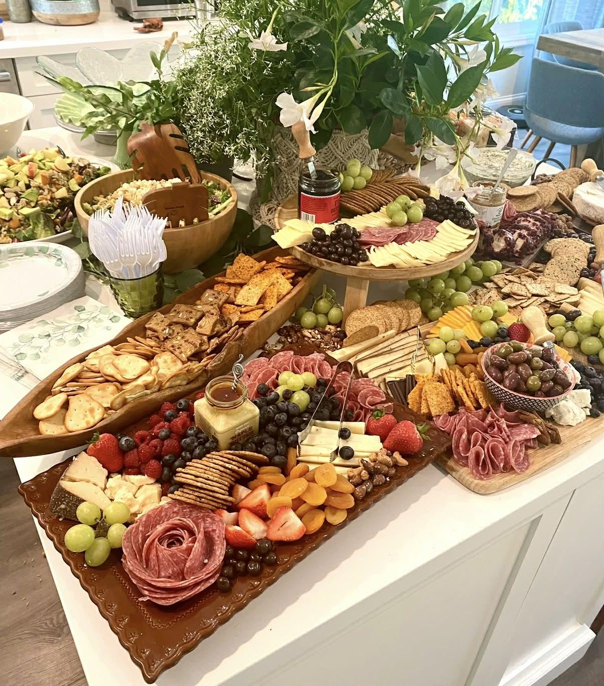 Family Style Catering charcuterie spread with meats, cheeses, fruit and crackers